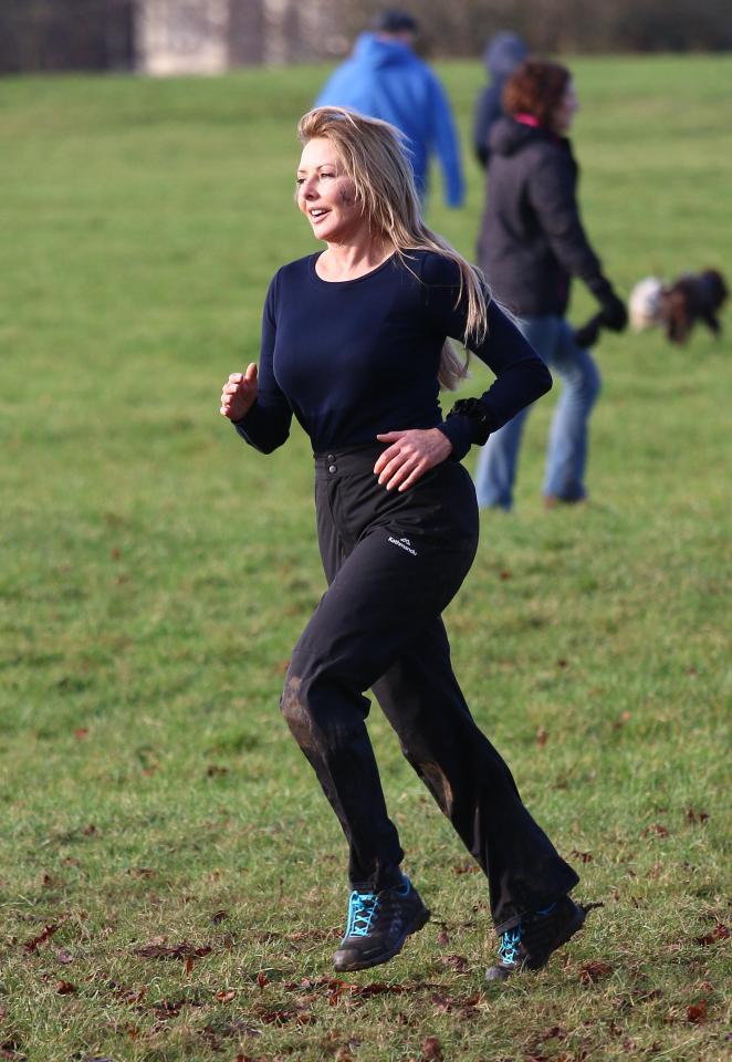  Jog to the front . . . Carol wears matching black gym gear for the workout