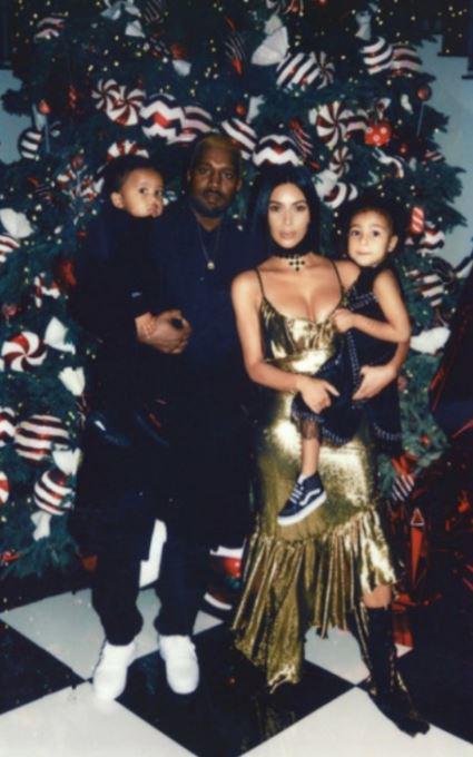  Kanye West appeared to dismiss the speculation surrounding the state of his marriage to Kim Kardashian by posting a happy family picture on his Twitter page