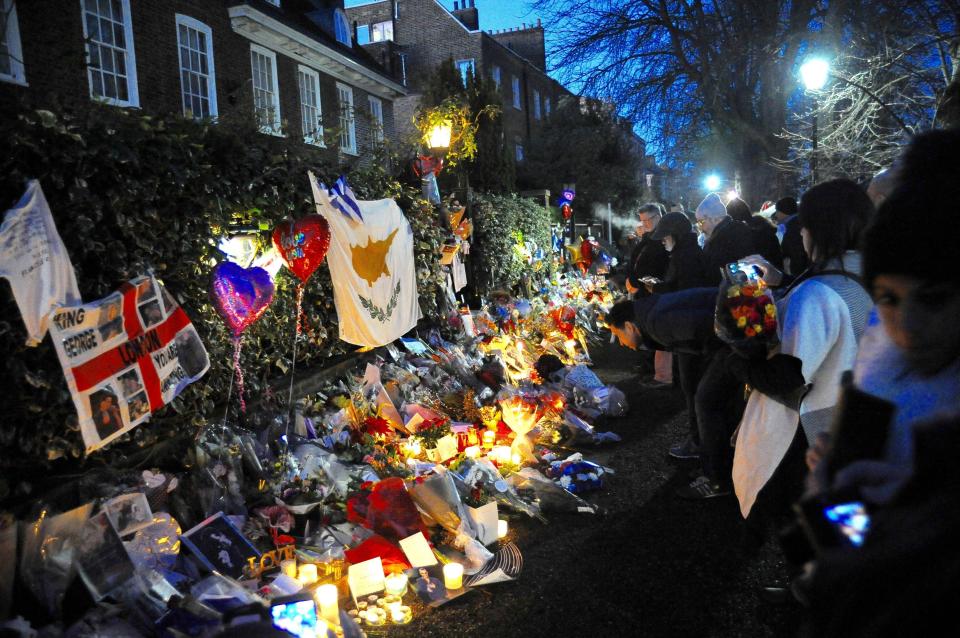  Fans build a shrine to George Michael outside his London home