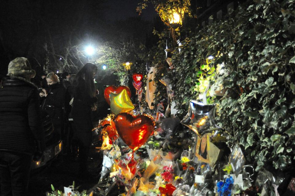  Floral tributes and notes were left as fans grieve for the former Wham! frontman