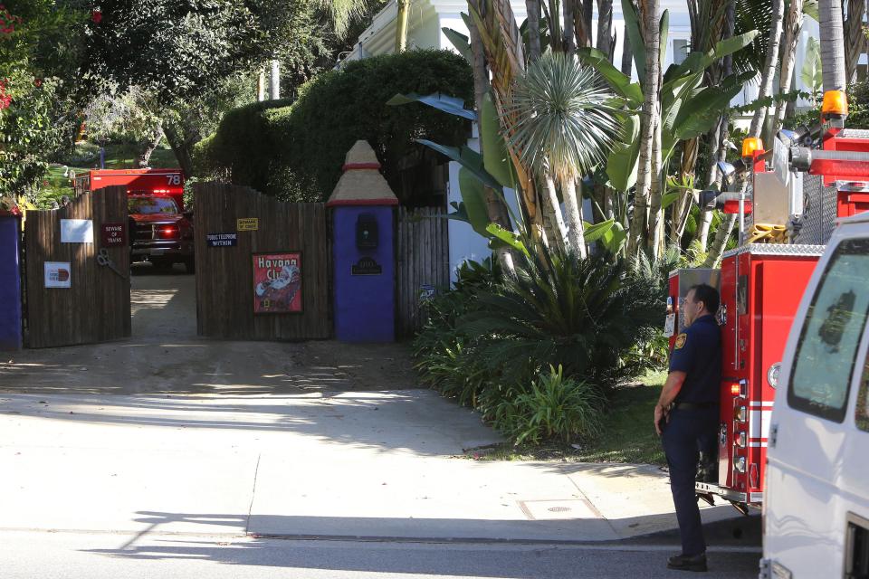  EMTs wait by the gated property in California