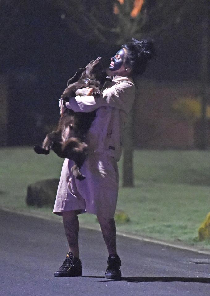  She scooped her beloved pooch up for a cuddle