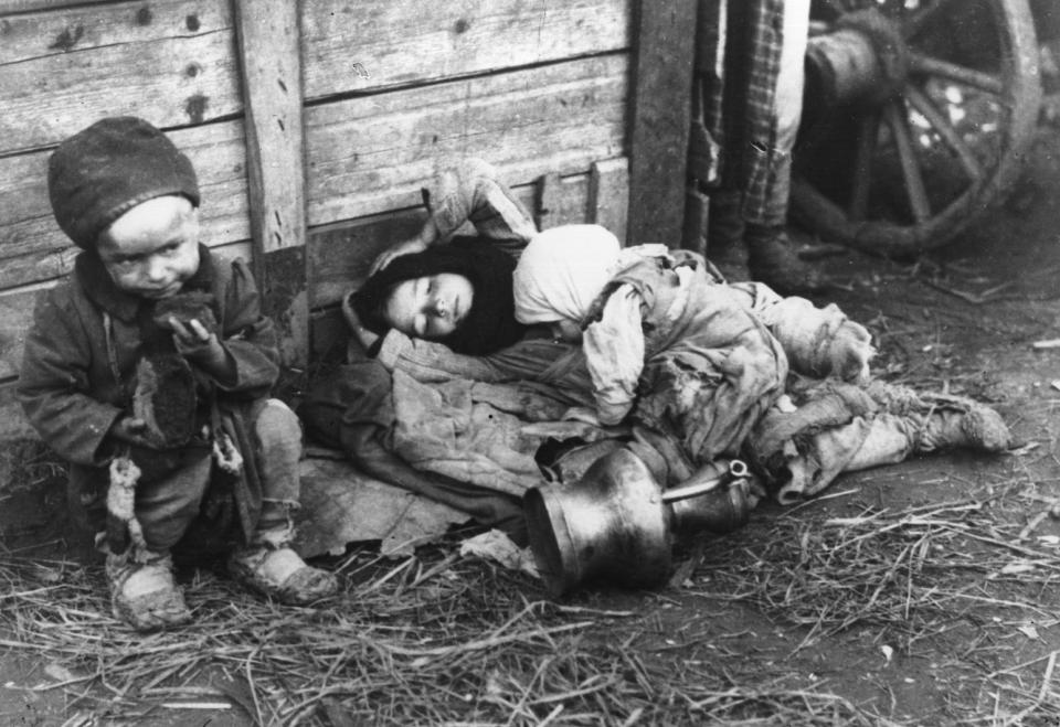  Three small children pictured cold and hungry during the devastating famine