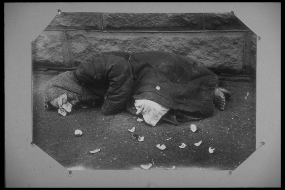  A victim of the famine pictured lying dead on the ground