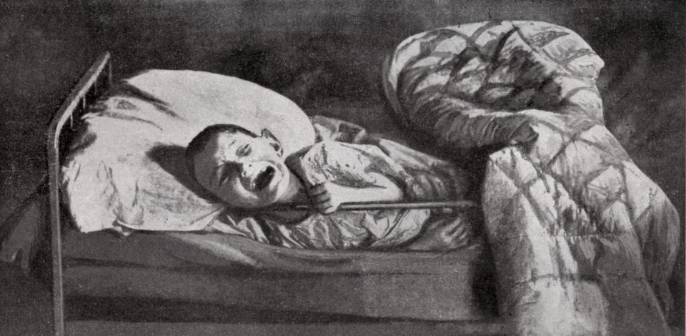  A child in a hospital bed screaming for food