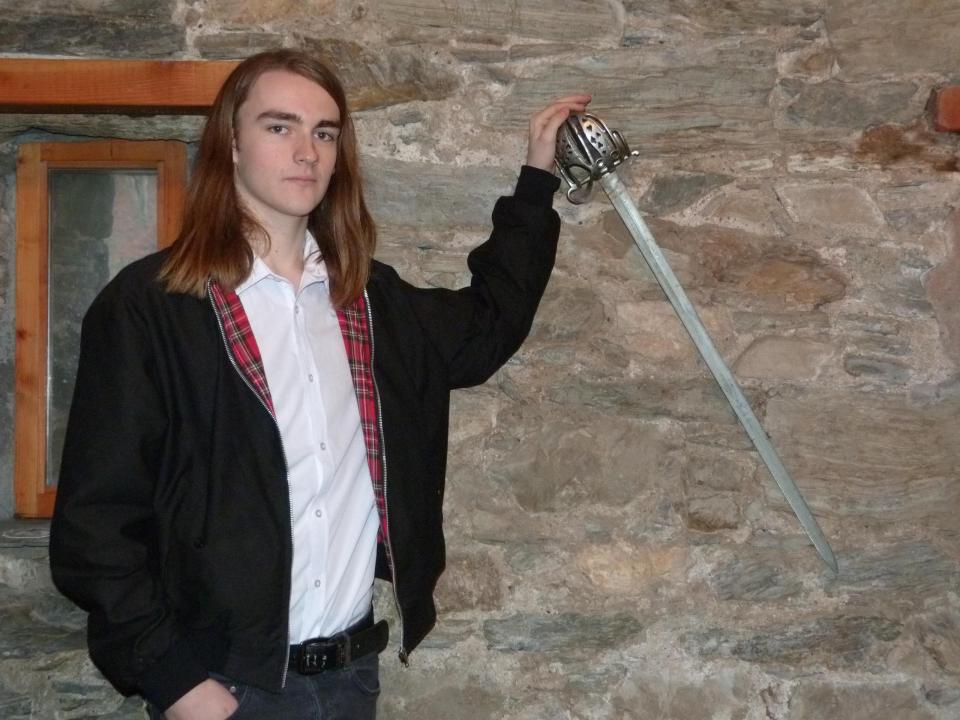  Barman Allan Colthart, 19, revealed that "swords on the wall have rattled" without explanation, which they blame on the ghost of the 18th century man  (Moira Kerr/Daily Record)