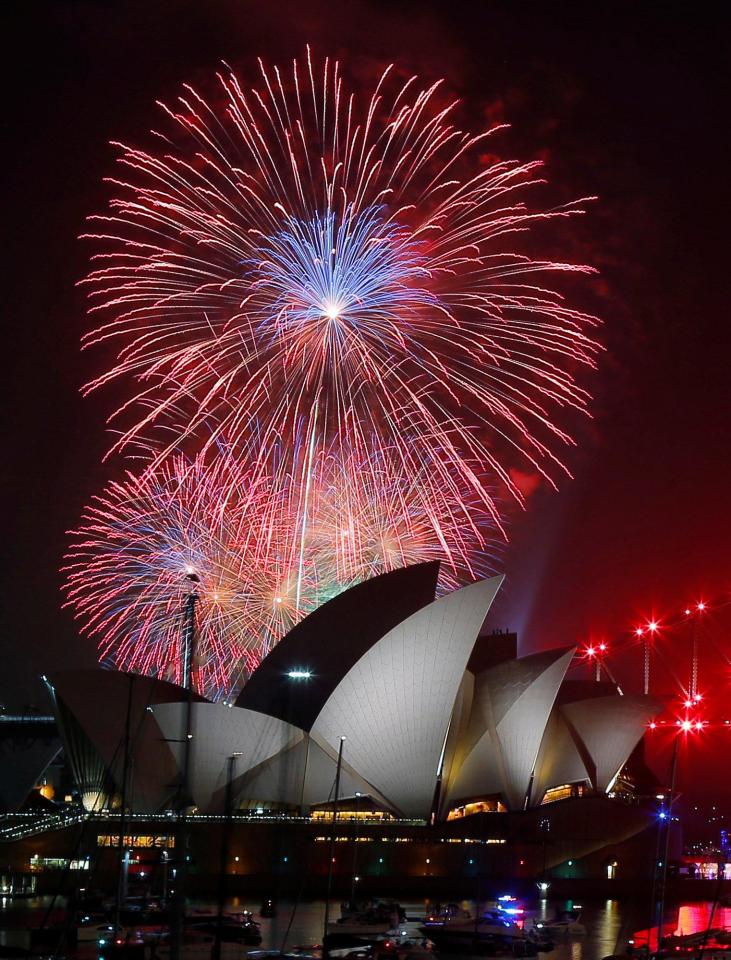  Fireworks explode over the Sydney Opera House during an early evening display in the lead up to the main New Year's Eve fireworks