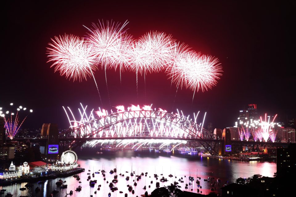  Fireworks go off on Sydney Harbour Bridge as the Australian city celebrates at midnight with the coming of the new year