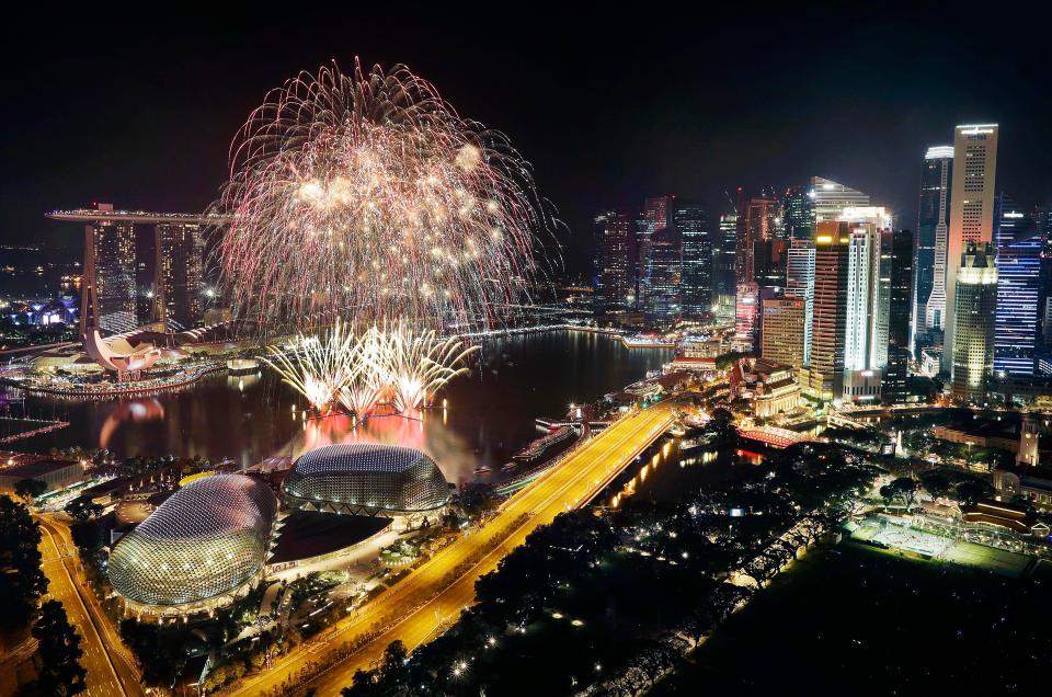  Fireworks explode above Singapore's financial district at the stroke of midnight