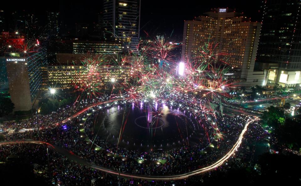  Fireworks illuminate the night sky over Traffict Circle of Hotel Indonesia during New Year's Eve celebrations