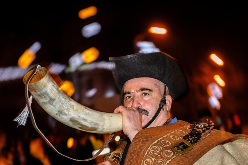  A horseherd blows a horn during the New Year's Eve celebrations in Hajduszoboszlo