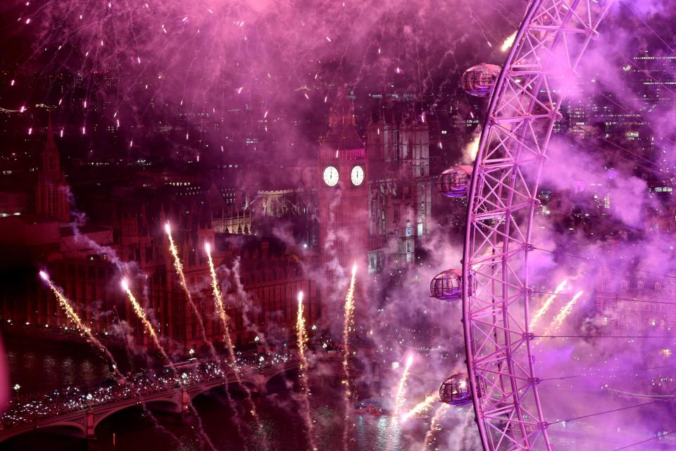  Fireworks light up the sky over the London Eye in central London during the New Year celebrations.