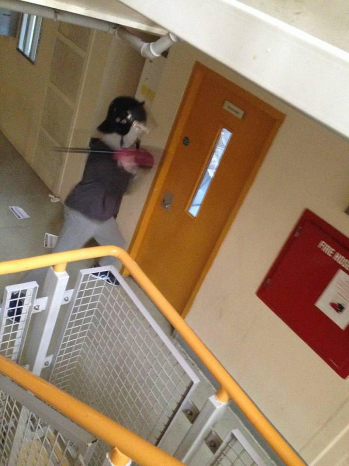  An inmate appears to break down a door wearing riot gear as lags take over four wings at Winson Green prison