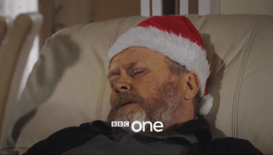 Phil lies dying in an armchair on Christmas Day 