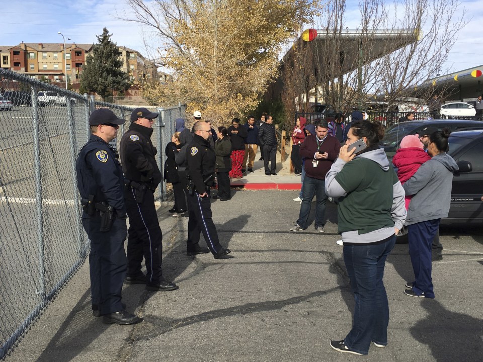  Worried parents gathered outside the school gates