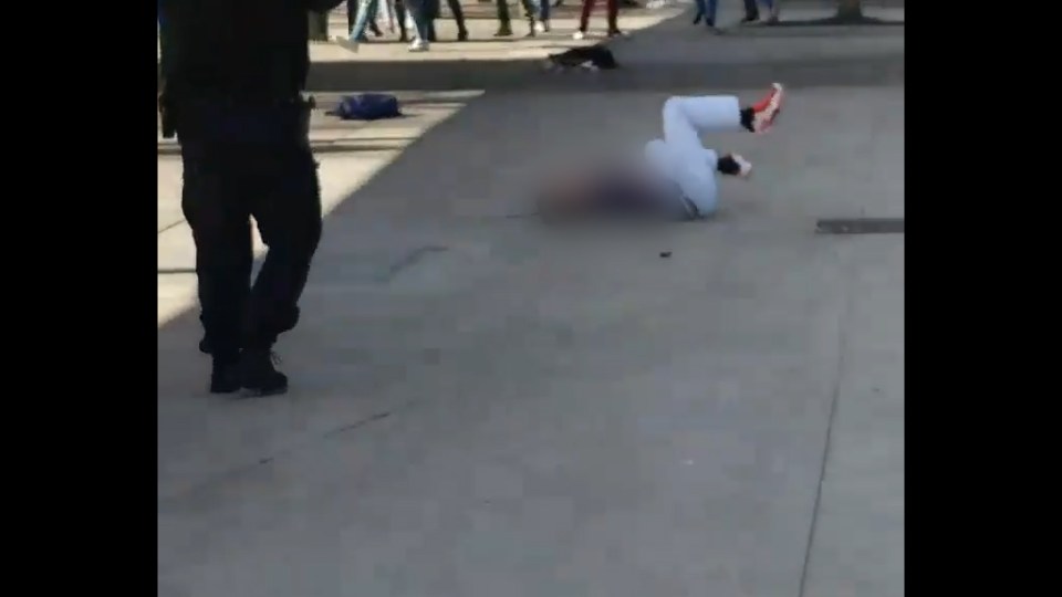  This is the moment a knife-wielding teen was shot by a cop at Hug High School in Nevada on Wednesday after he stabbed a classmate