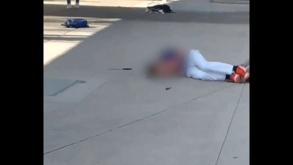  The student was filmed writhing on the ground after the shooting