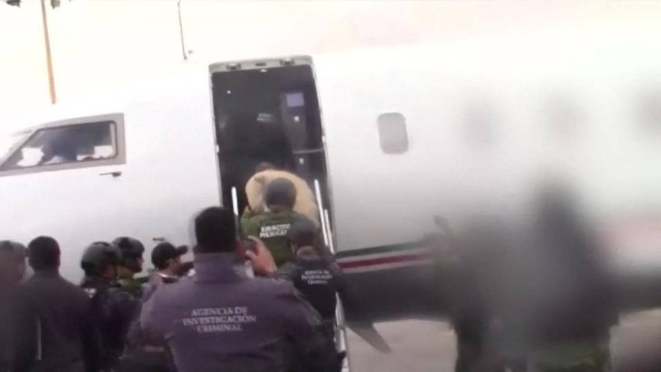  El Chapo boarding the plane that is taking him to justice in the US