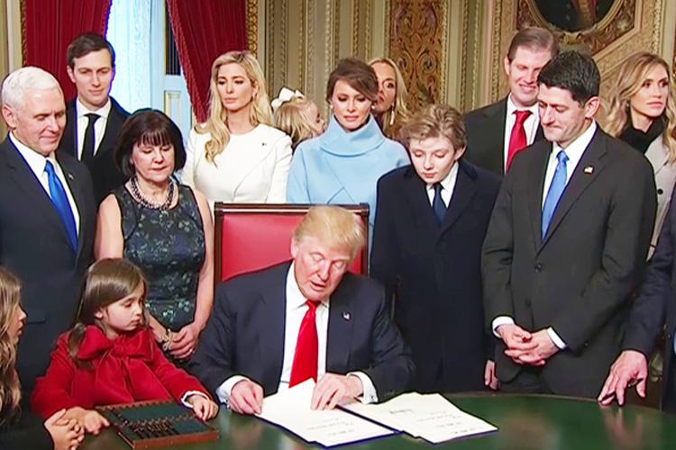  Donald Trump has formally "signed in" as US President - but his grand-daughter Arabella Kushner (in red) stole the show