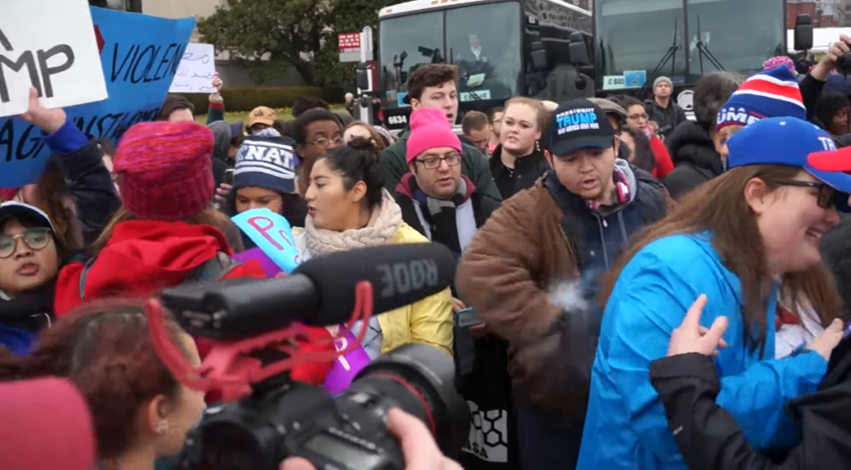  The lad pats out the flames in the young woman's hair