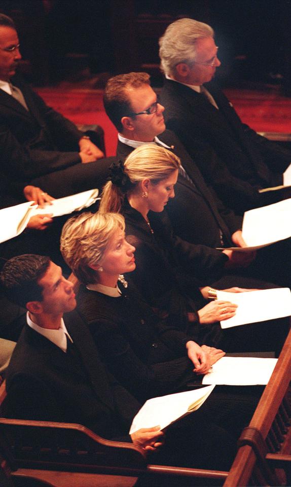  Photographs have emerged showing the suspect sitting near Hillary Clinton when she gave the eulogy at his mother Sonia's funeral