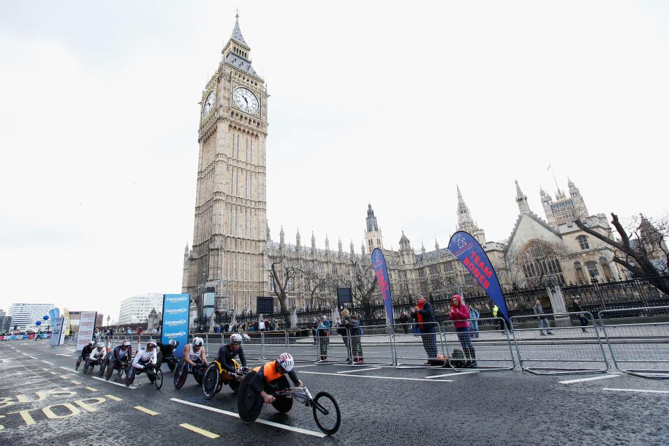  Wheelchair competitors speed past Big Ben and the Houses of Parliament