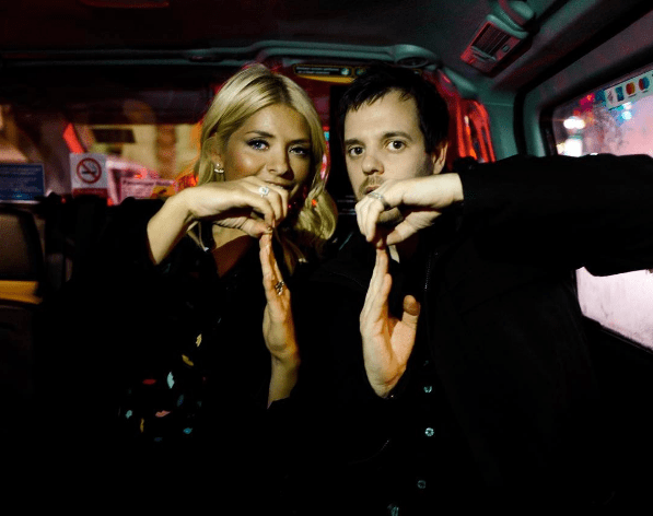  Mike Skinner also shared this snap of him mucking around with Holly in the back of a black cab