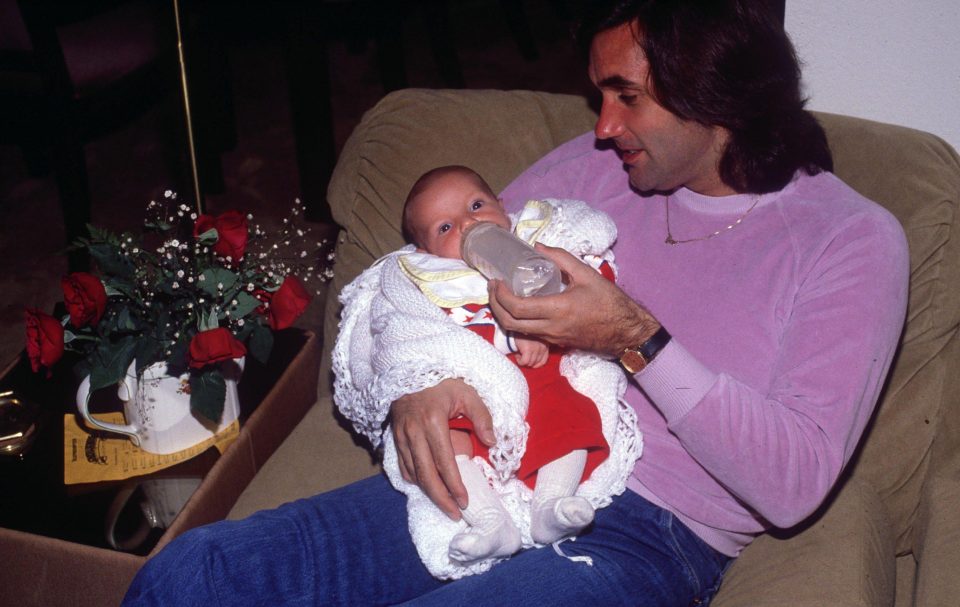  Calum as a baby being fed by his late father and iconic footballer George Best