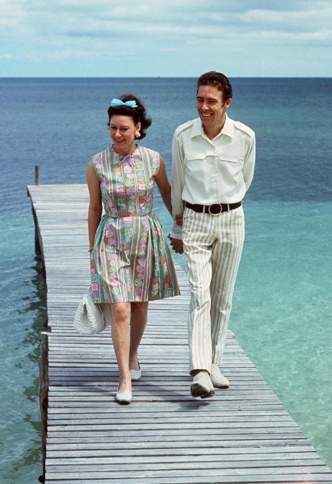  Princess Margaret and Lord Snowdon stroll down a pontoon in the Bahamas in March 1967