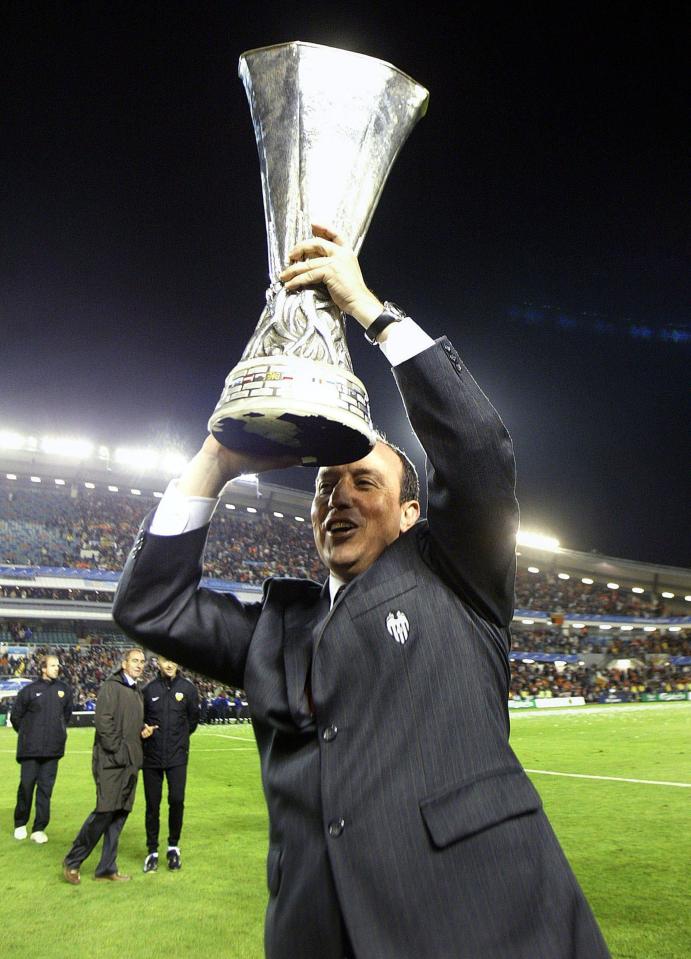  Rafa Benitez holds aloft the UEFA Cup Valencia won in 2004 - surely the first of many right/