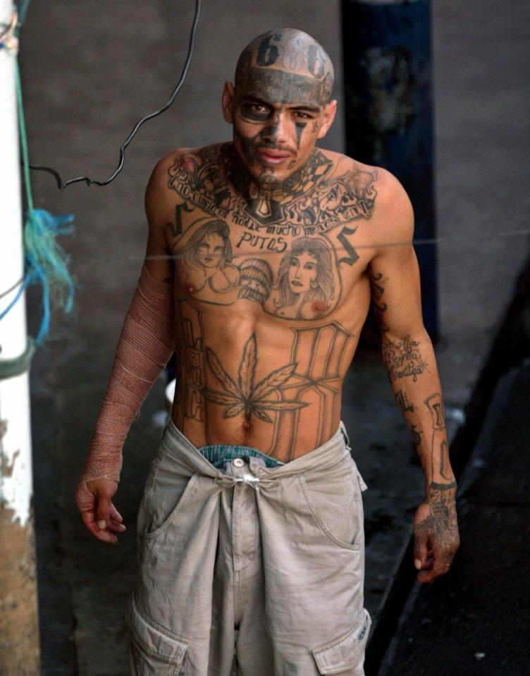  A gang member shows off his tattoos inside El Pavon jail in Guatemala