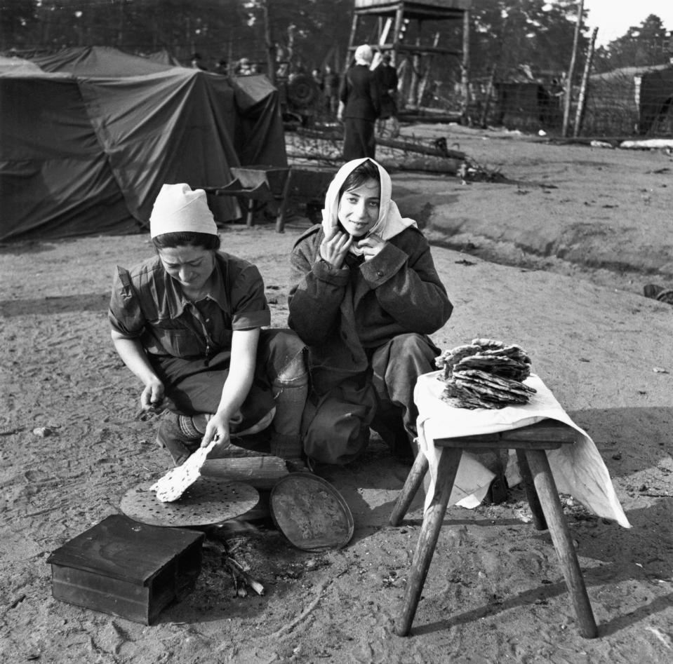  Women cook flatbread at Belsen, in April 1945