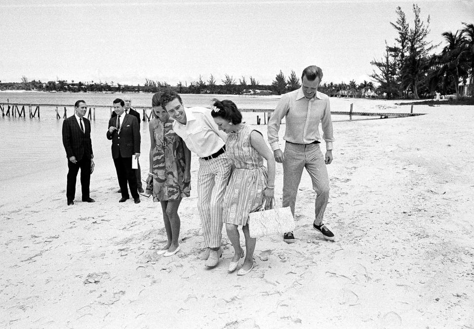  Princess Margaret and Lord Snowdon, centre, with hosts Jocelyn, right, and Jane Stevens, left, at their holiday home on Lyford Cay in the Bahamas on March 11, 1967