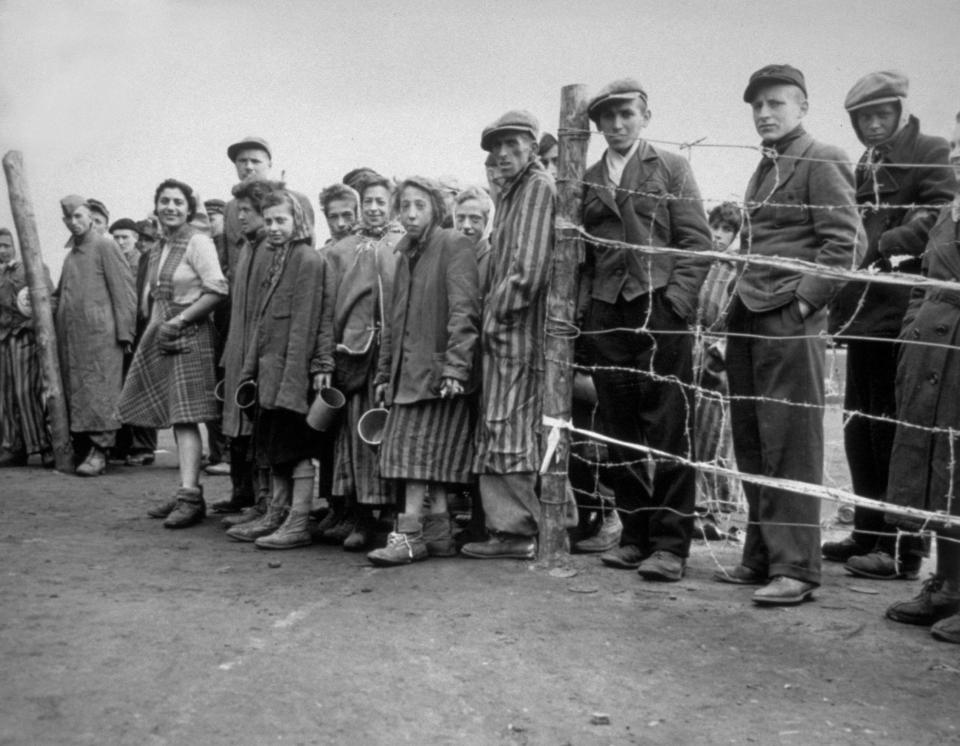  Starving children wait for their rations of potato soup, after Allie soldiers liberated the Belsen