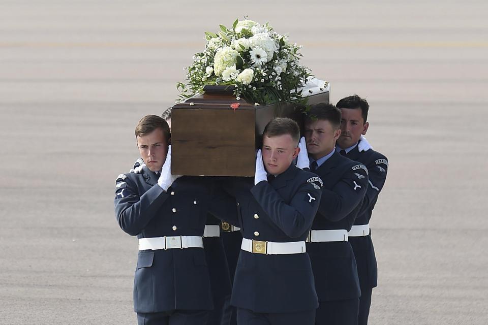  The coffin of Denis Thwaites is carried from an RAF C-17, which repatriated the bodies of eight British nationals killed in the Tunisia terror attack