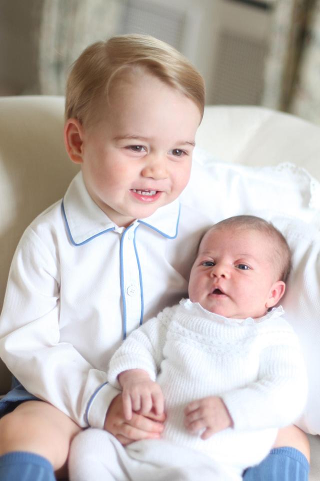  Princess Charlotte cuddles up to big brother Prince George