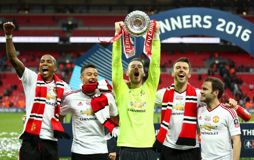  Young celebrates after lifting the FA Cup last season