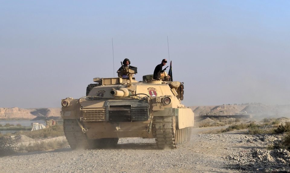  An Iraqi army M1 Abrams tank approaches a checkpoint near Qayyarah, Iraq as Britain and US forces continue their offensive to retake Mosul