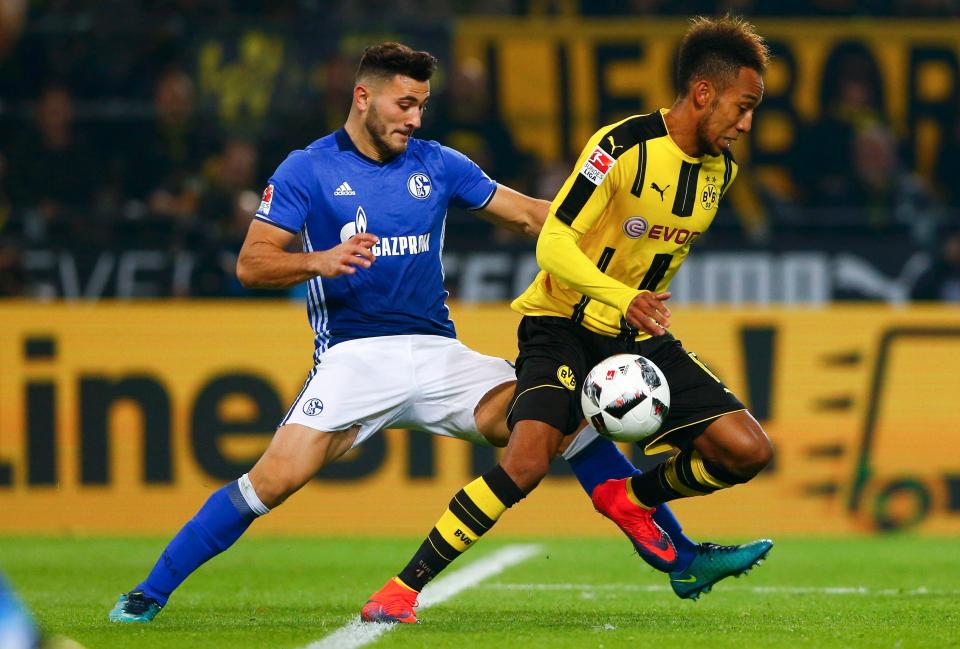  Dortmund's Pierre-Emerick Aubameyang and Schalke's Sead Kolasinac in action