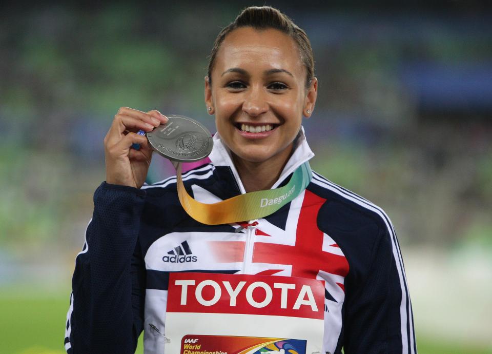 Ennis-Hill holds her silver medal which will updraded to gold