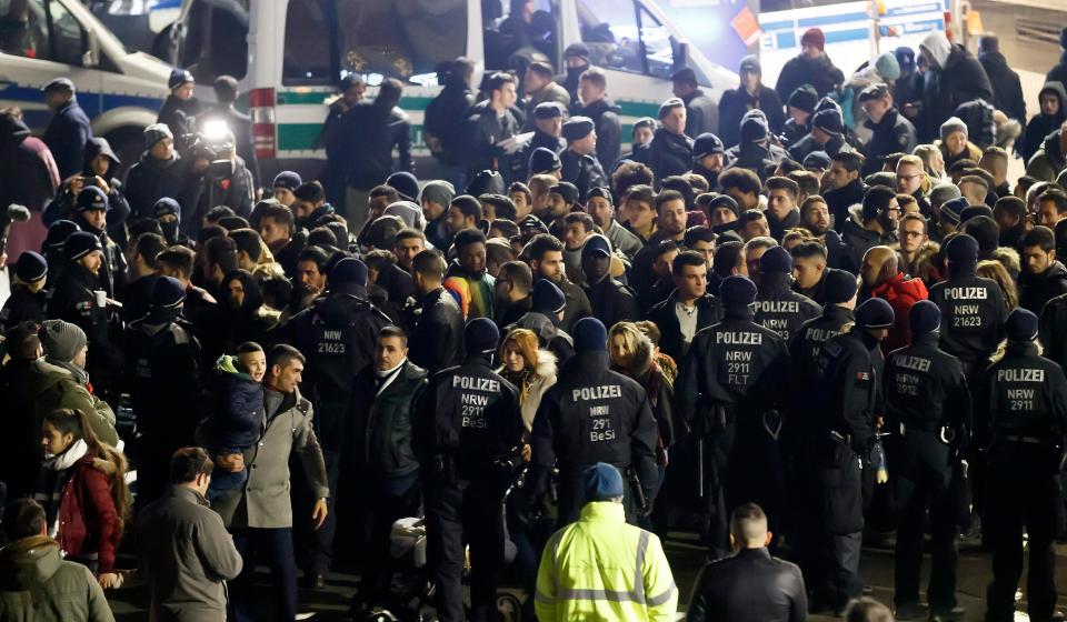  German police officers checking incoming people from North Africa in front of the Central Station in Cologne, Germany, on NYE