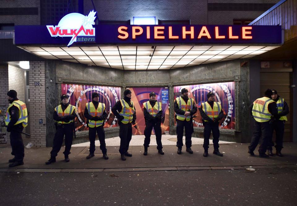  German police guard the venue at the Reeperbahn street in St.Pauli red-light district before the New Year celebrations for 2017