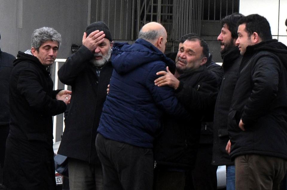  Family members of victims mourn their loved ones outside the morgue