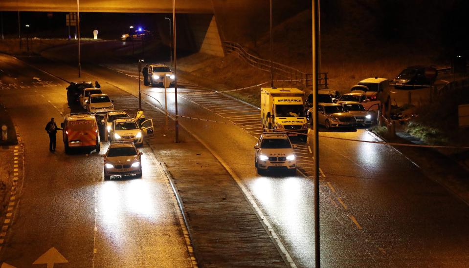  Paramedics and police at the scene at junction 24 after the shooting at around 6pm on Monday, which motorists initially suspected was the scene of a crash