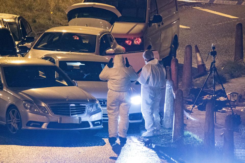  Forensic teams at work at the scene of last night's fatal shooting in Huddersfield