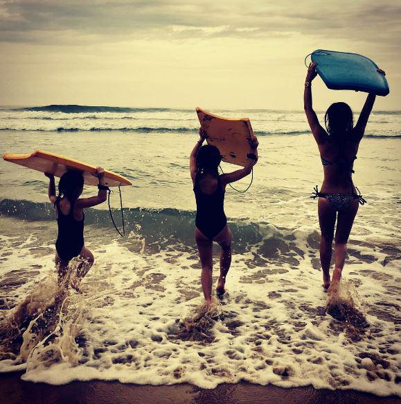 Myleene Klass shared this idyllic pic of her running in to the sea with her two daughters