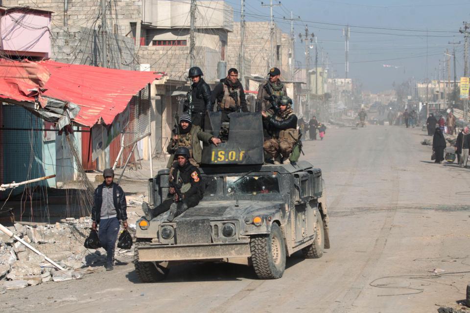  Iraqi special forces patrol the Al-Quds neighbourhood of Mosul after capturing it from ISIS