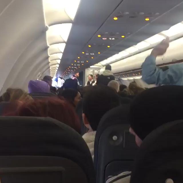  The passenger, wearing a cap and a hoodie, is escorted off the easyJet flight on the runway at Amsterdam airport