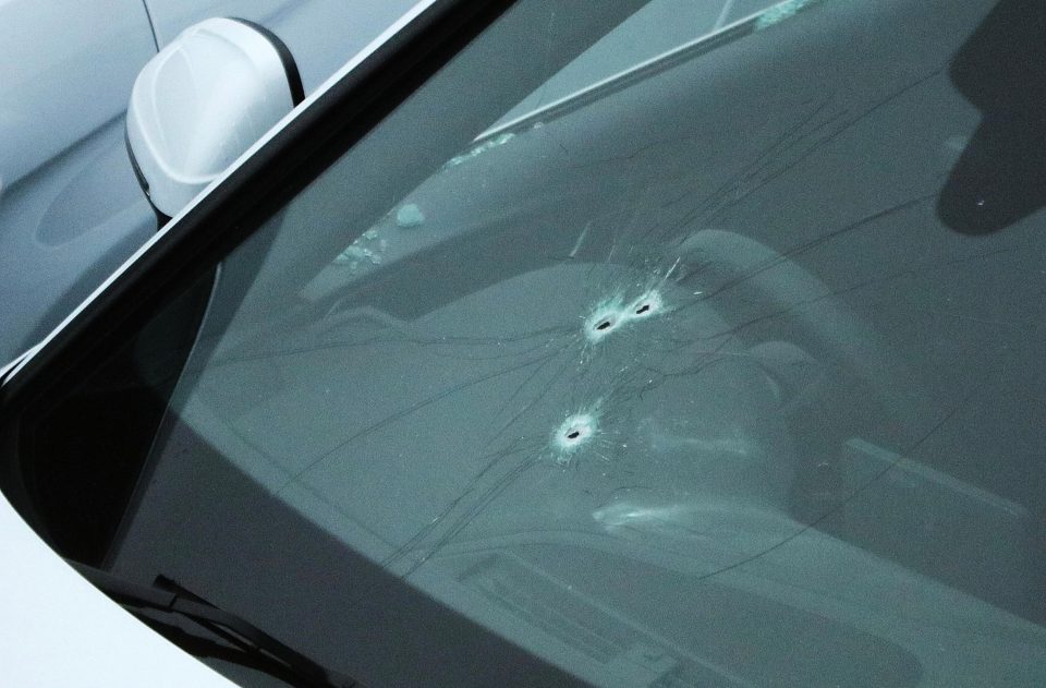  Bullet holes can be seen in the windscreen of Yaqub's car