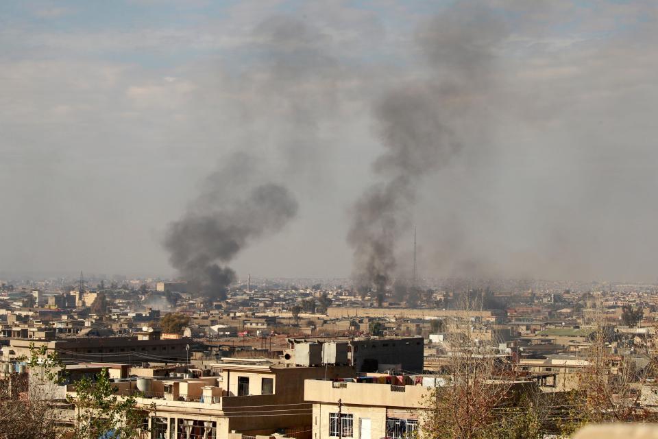  Smoke rises from Mosul as government forces clash with jihadis, the city has been the scene of fierce fighting between Iraqi and Kurdish forces and ISIS